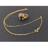 A 9ct gold ring set with a garnet and opals and a 9ct gold necklace, 6.1g. Location:Cab