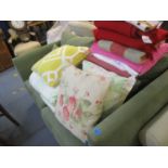 A modern patchwork style bed cover (double bed), mixed blankets and cushions Location: CR
