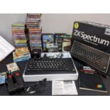 A ZX Sinclair Spectrum with manual, boxed games and a joystick, Location: LA2M