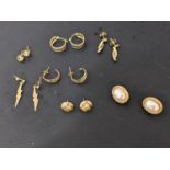Seven pairs of earrings to include a 14ct gold pair, three pairs of 9ct gold and three pairs of gold