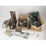 A collection of early 20th century surgical implements, to include a drill, catheters, dilators,