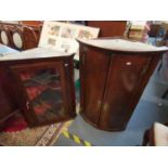 A Georgian oak bow fronted corner cabinet together with a 19th century mahogany corner cabinet