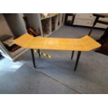 A retro coffee table raised on dansette legs, 55h x 95 w x 30cm d Location: LAB
