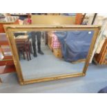 A large gilt framed mirror with bevelled plate, 137 x 106cm Location: SL