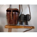 A pair of WWII Ross London prism binoculars with leather case and a vintage oak truncheon