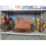 Group of African carved masks, a wall plaque and an ironwood tray