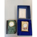 A Halcyon days enamelled clock in box together with a marble clock in the form of a book Location: