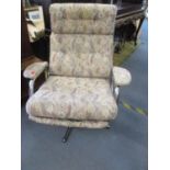 A vintage chrome swivel chair Location: C