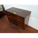An early 20th century mahogany table top collectors chest of four graduated long drawers Location: G