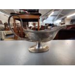 A 20th century Chester silver sauce boat, 97g, A white metal continental trinket pot in circular