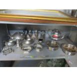 Silver plate to include a pair of bottle coasters, a toast rack, condiments, salts and other items