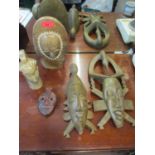 Two African Bois Gris carved Gabon wooden masks, two Pierre Bijou carved stone heads, signed, and