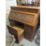 A mid 20th century Chinese carved hardwood bureau, four short drawers over a fall flap with