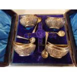 A set of four early 20th century silver salts and spoons in original case, 88g Location: Porter