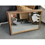 A modern mirror with bevelled plate, 69 x 98cm Location: C