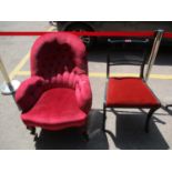 A black painted dining chair, together with a Victorian armchair in a red velour upholstery A/F