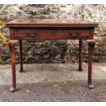 A George III mahogany fold over tea table, with twin handled single frieze drawer, supported on four