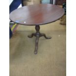 A 19th century mahogany tilt top table, raised on turned support with carved acanthus leaf