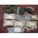 A quantity of 1990s Military desert kit, miscellaneous uniform accessories and two gas masks