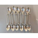 A set of eleven sterling silver spoons, 87g Location: Cab