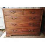 A George III straight fronted mahogany chest of drawers, with two short drawers over three graduated