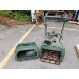An Atco Malmoral 175 petrol lawn mower with instructions Location: G