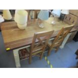 A modern Sapele hardwood finished refectory style kitchen table, standing on painted, fluted legs