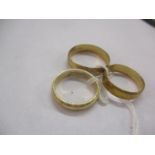 Three 9ct gold wedding bands, 6.9g Location: Cab