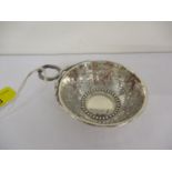 A late 19th century white metal wine taster, with images of grapes and vines, 47.8g Location: Cab