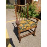 A 20th century oak stick back rocking chair Location: