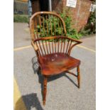 An ash and elm Windsor arm chair with label for 'Holbrooks Reproductions' Location: CF