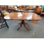 An early 19th century mahogany tilt top breakfast table, raised on turned column support, four