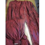 A pair of crimson red taffeta curtains with pleated heading, lined and fleece interlined measuring