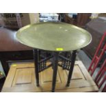 A brass topped tray occasional table on a turned and folding base Location: LAB