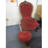 A Victorian mahogany nursing chair and a Victorian footstool, both with a red upholstery Location: C