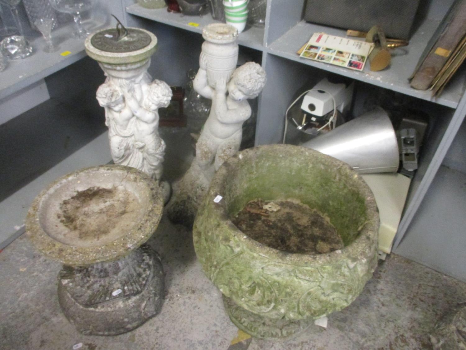 Mixed stoneware garden items to include a statue, sundial, bird bath and a planter Location: