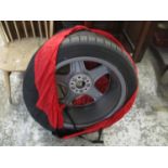 A Conti Sport Contact 5 SSR Continental spare tyre, with dust cover