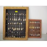 A collection of souvenir spoons in wall hanging cases Location: RAM