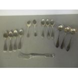 A group of Georgian Scottish and later silver spoons, a fork and three Georgian sauce ladles,