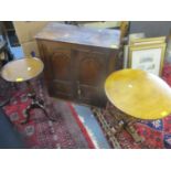 An oak two door wall hanging cabinet together with two occasional tables