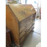 A Georgian mahogany bureau, 107 h x 111 w x 56cm d. Location:Foyer