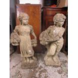 Two garden stoneware statues of a boy and girl each holding a basket, 74cm high Location: G