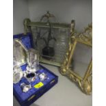 A Tantalus with two glass decanters dated 1898, an early 20th century gilt photo frame, a