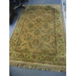 A beige ground rug having multiguard borders and a floral design, 184 x 124cm. Location: Stage