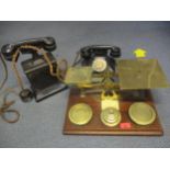 An oak and brass set of postal scales with weights together with an Ericsson cast iron and wood