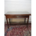 An early 19th and later mahogany side table converting into a dining table A/F, with central