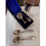 Silver to include a cased christening set, a cream jug and a pair of teaspoons, 155g Location: