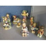 A group of nine Goebel Hummel figurines to include Serenade, one A/F, and a Fredal figurine