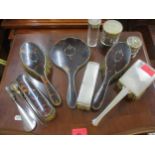 A four piece silver and tortoiseshell brush set including mirror together with a button hook,