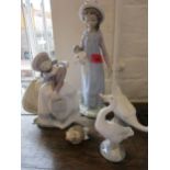 Three items of Lladro and a model of a Nao goose Condition: One Lladro figure has a broken head